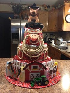 a cake made to look like a farmyard with animals on top and hay around it