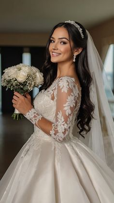 a woman in a wedding dress holding flowers