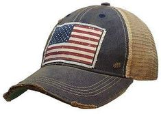 American Flag USA vintage distressed trucker cap. Color: Navy Blue distressed. Material: cotton/polyester blend, mesh back. Size: one size fits most, with an adjustable snapback strap. Unisex cap. Cheap Patriotic Snapback Trucker Hat, Patriotic Accessories, American Flag Hat, Country Hats, Americana Vintage, Flag Hat, Vintage Trucker Hats, Hat Patches, Cap Mens