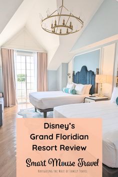 a hotel room with two beds and a chandelier