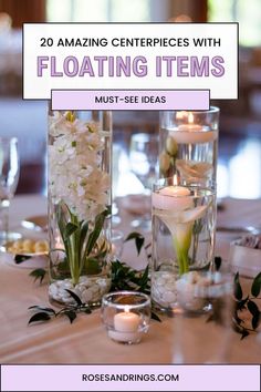 two tall vases filled with flowers and candles on top of a table