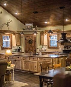 a large kitchen with wooden cabinets and an island