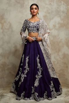 Dark aubergine lehenga with placement embroidery using zardozi, pearls, sequins. Paired with a blouse with all over paisley, floral embroidery using zardozi work. Comes along with a champagne dupatta. - Aza Fashions Purple Choli With Sheer Dupatta For Reception, Purple Embroidered Choli For Reception, Silk Blouse, Floral Embroidery, Half Sleeves, Aza Fashion, Lehenga, Round Neck, Paisley