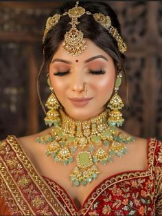 a woman wearing an elaborate necklace and earrings