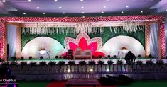 the stage is decorated with flowers and decorations