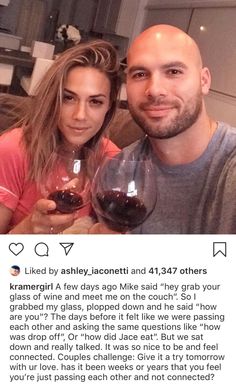 a man and woman holding wine glasses in front of a photo with the caption