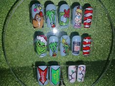 "\"Whoville\" Hand painted full press on nail set Includes 14 nails in 7 sizes! This hand-painted Grinch-themed nail set includes iconic images from the famous movie! Max the Dog, The Grinch, Cindy Lou Who and more! Show off your holiday spirit in style with this unique, fun set! Can be created in your custom sizes and preferred shape and length. Includes nail glue, file, cuticle stick, alcohol wipe and instruction sheet." Grinch Nail Stickers, Cindy Lou Who Nail Art, Cindy Lou Who Nails, Whoville Nails, Grinch Christmas Nails Acrylic, Grinch Gift Basket, The Grinch Nail Art, Christmas Character Nails, Grinch Nails Designs