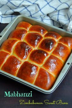 a pan filled with hot cross buns sitting on top of a table