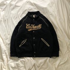 CARHATT Embroidery Logo Button Varsity Jacket TAG : Carhatt SIZE : Large MEASUREMENT , - Width (Armpit to armpit) : 23.5" - Length (Shoulder the end of garment) : 27" CONDITION : Perfect used, no holes Nd stains ** PLEASE LEAVE ME YOUR PHONE NUMBER ON THE NOTE AFTER MADE A PURCHASE, ITS FOR COURIER NEEDED ** SHIPPING, all item will be shipped with tracking number. Item received within 14-21 working days. Retro Long Sleeve Outerwear With Letter Embroidery, College Fall Outerwear With Buttons, Fall College Outerwear With Buttons, Varsity Style Winter Outerwear With Buttons, Varsity Style Buttoned Outerwear For Winter, Retro Embroidered Varsity Jacket For Fall, Embroidered Retro Varsity Jacket For Fall, Winter Streetwear Button-up Varsity Jacket, Winter College Outerwear With Buttons