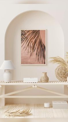 a living room with white furniture and a painting on the wall