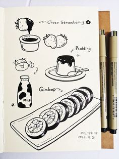 an open notebook with some food on it and two markers next to it, including chocolate strawberry pudding