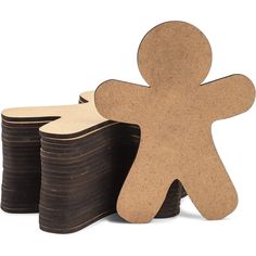 a wooden man standing next to stacks of black poker chips on top of each other