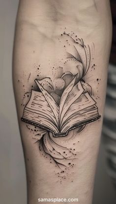 an open book tattoo on the leg