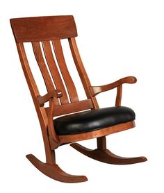 a wooden rocking chair with black leather seat and armrests on an isolated white background