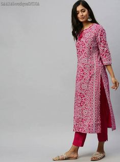 HAND CRAFTED KURTA SET DESCRIPTION *Pink and white bandhani printed kurta with trousers *Pink and white bandhani printed straight calf length kurta, has a tie-up neck, three-quarter sleeves, straight hem, side slits *Pink solid trousers, has elasticated waistband, slip-on closure *Fabric:- Top fabric: Pure Cotton Bottom fabric: Pure Cotton *Wash Care:- Hand-wash AVAILABLE IN 5 SIZES THEY ARE IN FOLLOWING MEASUREMENTS IN INCHES:- S:- Bust-36/Shoulder-14/Top Length-46/Bottom Waist-30/Bottom Length Bohemian Pink Block Print Sets, Bohemian Pink Sets With Block Print, Fitted Pink Kurta With Self Design, Pink Block Print Sets With Long Sleeves, Bollywood Style Pink Block Print Sets, Pink Semi-stitched Cotton Dress, Bollywood Style Pink Sets With Block Print, Pink Bollywood Sets With Block Print, Pink Long Sleeve Block Print Sets