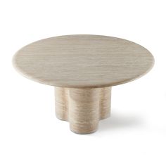 a round wooden table sitting on top of a white floor