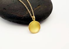 Dainty 18k Gold Necklace with Pendant.  Round Disc Pendant Necklace in 18k Gold. This gold disc pendant is made from 18k solid gold. It has been formed from a 1 gram nugget of 18k gold into a round disc that has then been made into a concave dish shape that is 9-10mm in diameter.  The inside of the dish is has a matte finish that brings a warmth to the 18k gold  and that contrasts with the polished outside edges.  The 18k gold has a very sunny color that brings a brightness and makes this stand out as a minimalist piece.  The delicate chain is a 18k solid gold cable chain that is 1.1mm - choose your length in the options.  All designs are handmade to order in my studio in Colorado.  All designs purchased come in a box ready for gifting. Gold Necklace With Pendant, Necklace With Pendant, 18k Gold Necklace, Gold Disc, Disc Pendant, Delicate Chain, Necklace Gold, Cable Chain, Favorite Jewelry