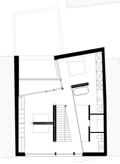 the floor plan for this modern home is shown in black and white, with stairs leading up to the upper level