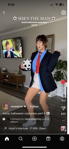 the woman is dressed up in shorts and a blazer while holding a soccer ball