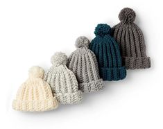 four knitted hats lined up in different colors