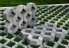 two cement blocks sitting on top of grass