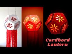 three red and white paper lanterns hanging from strings, with the words cardboard lanternen above them