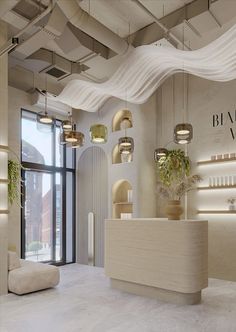 the interior of a salon with white walls and ceiling lights hanging from it's ceilings