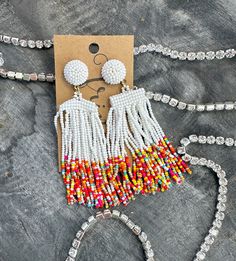 "Vibrant tassel statement earrings made with seed beads!   Length- Approx. 3.75\" Back- Post back Nickel and lead compliant FINAL SALE- please check dimensions and details before purchasing, just to ensure these will work for you!" White Dangle Beaded Earrings With Tassels, Summer Fringe Dangle Chandelier Earrings, Summer Multicolor Beaded Fringe Chandelier Earrings, Summer Beaded Fringe Tassel Dangle Earrings, Summer Beaded Fringe Tassel Earrings, White Fringe Beaded Dangle Earrings, White Tassel Earrings With Dangling Beads For Summer, Summer Beaded Fringe Chandelier Earrings, White Beaded Fringe Earrings For Summer