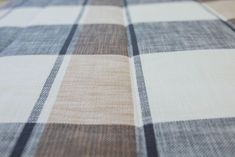 a checkered table cloth with black and white lines on it's edges is shown