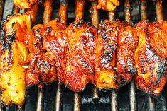 chicken wings are being cooked on the grill