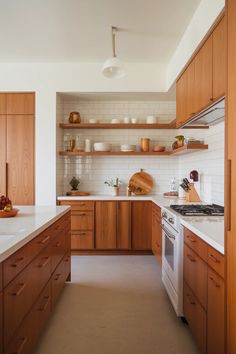 the kitchen is clean and ready for us to use it's counters are made of wood