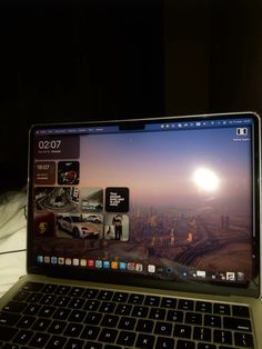 an open laptop computer sitting on top of a table