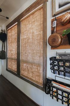 a kitchen with wooden blinds hanging on the wall