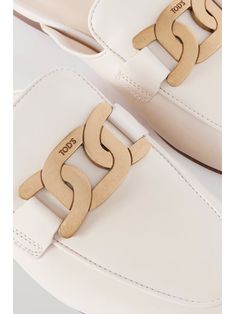 TOD'S Embellished leather slippers | NET-A-PORTER White Calf Leather Mules With Branded Heel Counter, White Luxury Calf Leather Mules, Luxury White Calf Leather Mules, Classic White Mules With Removable Insole, Designer White Leather Mules, White Leather Mules For Formal Occasions, Chic White Calf Leather Mules, Luxury White Round Toe Mules, Luxury White Mules With Round Toe