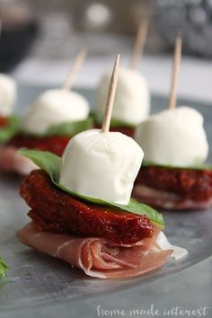 small appetizers with meat and cheese on them