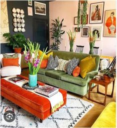 a living room filled with furniture and lots of plants on top of the couches