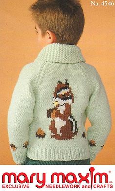 a young boy wearing a sweater with a fox on it