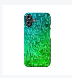 a green phone case with an intricate design on the front and back cover, sitting on top of a white surface