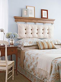 a bedroom with blue walls and white bedding