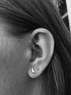 a woman with ear piercings on her ears