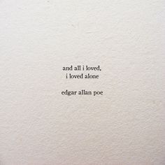 an old typewriter with the words and all i loved, i loved atone edgar allen poe