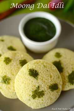 three moong dalai on a plate with dipping sauce