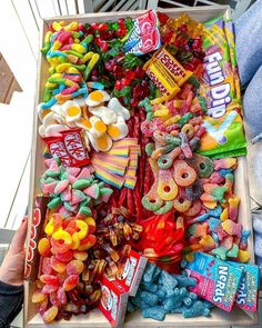 a box filled with lots of colorful candy