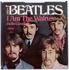 the beatles magazine cover with an image of four men in suits and ties on it