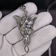 This gorgeous Arwen Evenstar necklace is just like the one she gifted to Aragorn in the Lord of the Rings trilogy. The Arwen pendant is made a high-quality S925 Sterling Silver, which means it will last through the ages. Plus, it comes with a free jewelry box! This Arwen Evenstar pendant is NOT made with cheap materials, like other Evenstar replicas you'll find. Similar Arwen pendants are made with silver toned zinc alloy, plated copper or even aluminum, which will fade over time or easily break Arwen Aesthetic, Lotr Collection, Lord Of The Rings Necklace, Lotr Arwen, Evenstar Necklace, Aesthetic Diys, Arwen Evenstar, Lord Of The Rings Trilogy, Fantasy Pendant