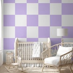 a baby's room with purple and white checkered wallpaper, rocking chair and crib