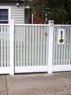 a white picket fence in front of a house