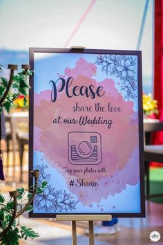 a sign that says please share the love at our wedding