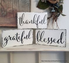 three wooden signs that say grateful and grateful