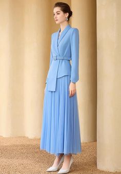 Say hello to that look of yesteryear with this Sky Blue Pleated Skirt Suit! Graceful and timeless, it features a full skirt, perfect for twirling and showing off your best dancing moves. Plus, you won't have to wait long to add it to your wardrobe - buy now and start showing off that sophisticated '50s style! Peak lapels; double-breasted V-neck, Long sleeves; button cuffs. Structured shoulders. Full pleated skirt with high waist Belted POLYESTER 100% Imported Brand - Aision Model: 233004 Sky Blue Blazer, Blazer With Skirt, Wedding Guest Outfit Winter, Elven Dress, Blue Pleated Skirt, Big Box Braids Hairstyles, Cute Short Dresses, Royal Outfits, Outfit Winter